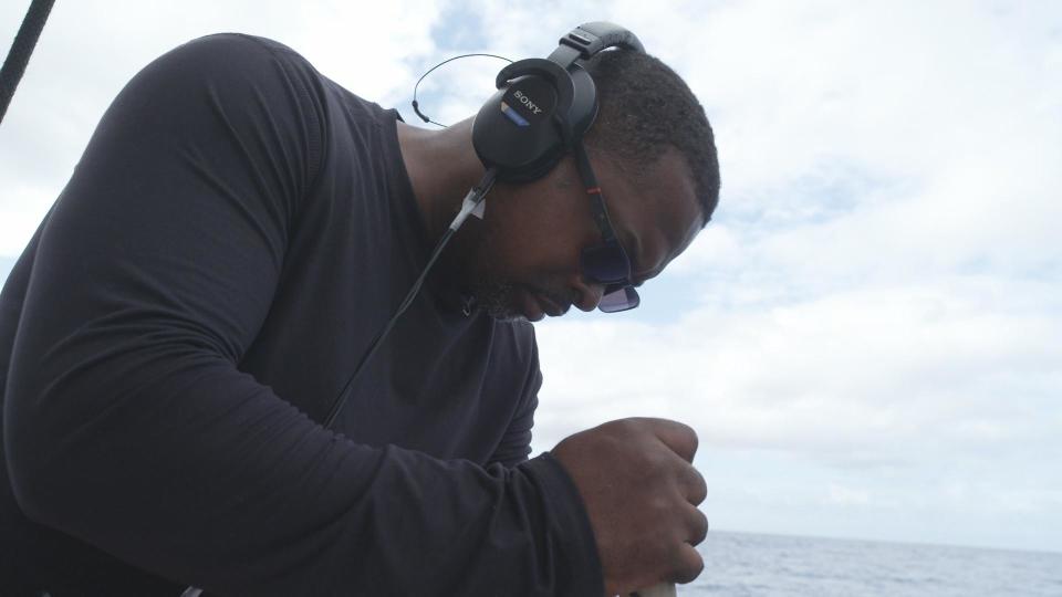 Captain Curt Benoit listens for whales / Credit: 60 Minutes