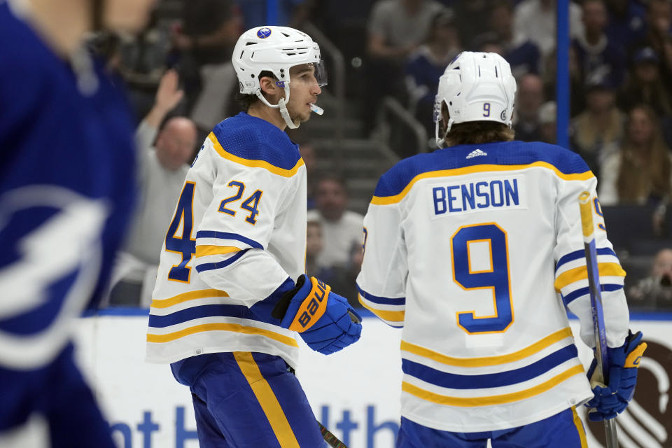 Buffalo Sabres center Dylan Cozens (24) celebrates after his goal against the Tampa Bay Lightning with left wing Zach Benson (9) during the first period of an NHL hockey game Monday, April 15, 2024, in Tampa, Fla. (AP Photo/Chris O'Meara)