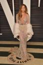 <p>Here she is looking absolutely FLAWLESS at the Vanity Fair Oscar Party repping that old Hollywood glam in a shimmery dress.</p>