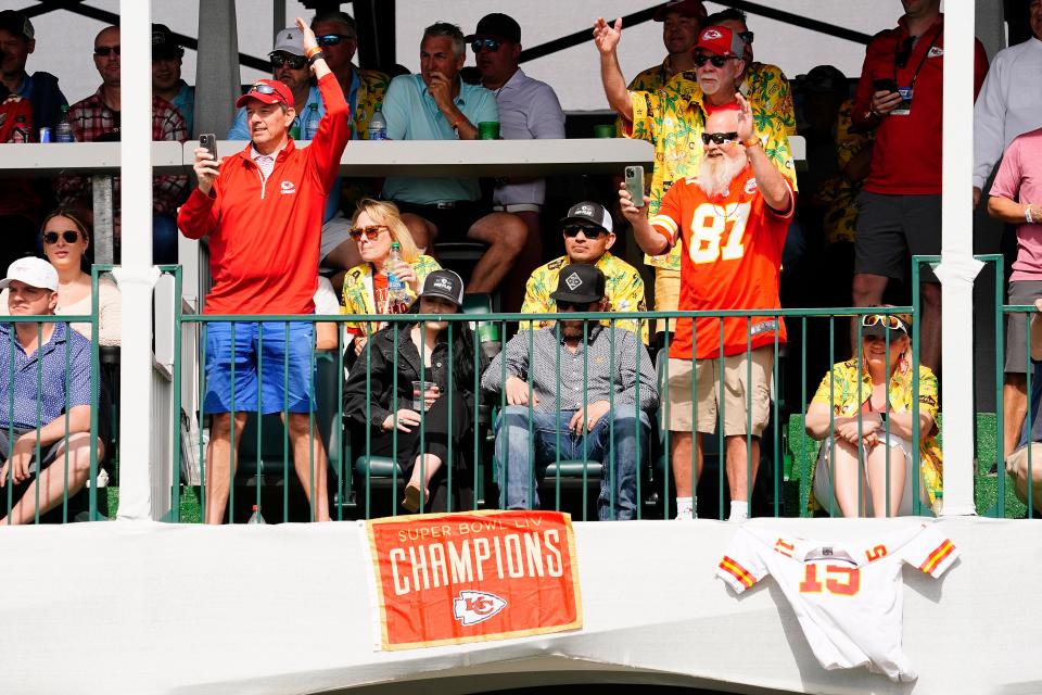 Kansas City Chief fans do the "tomahawk chop" on the 16th hole at the Phoenix Open golf tournament.