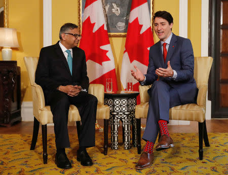 Canadian Prime Minister Justin Trudeau speaks to Tata Sons Chairman Natarajan Chandrasekaran during a meeting in Mumbai, India, February 20, 2018. REUTERS/Danish Siddiqui