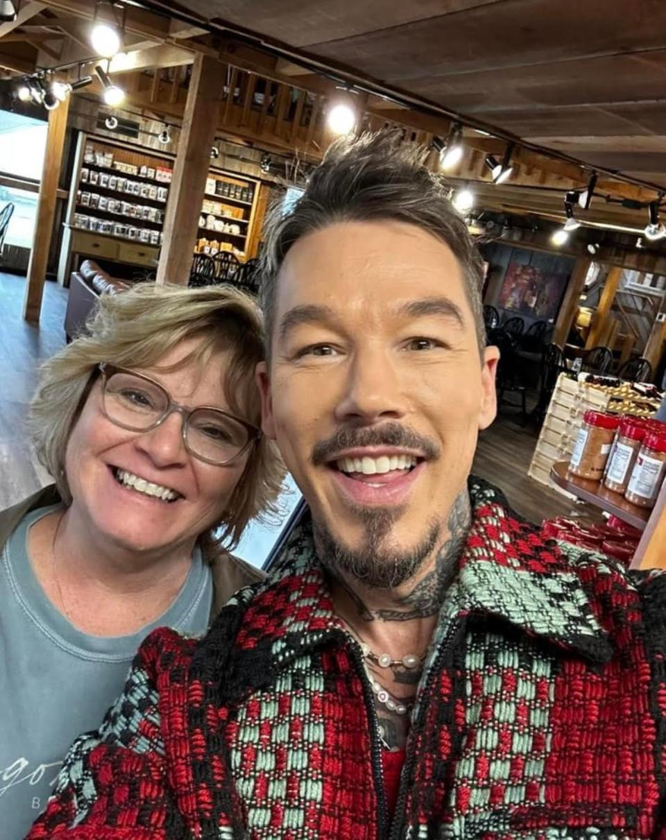 David Bromstad takes a selfie with Tisha Mozena of Newcomerstown on March 10. Bromstad, the host of My Lottery Dream Home, was filming in Canton when the two met.