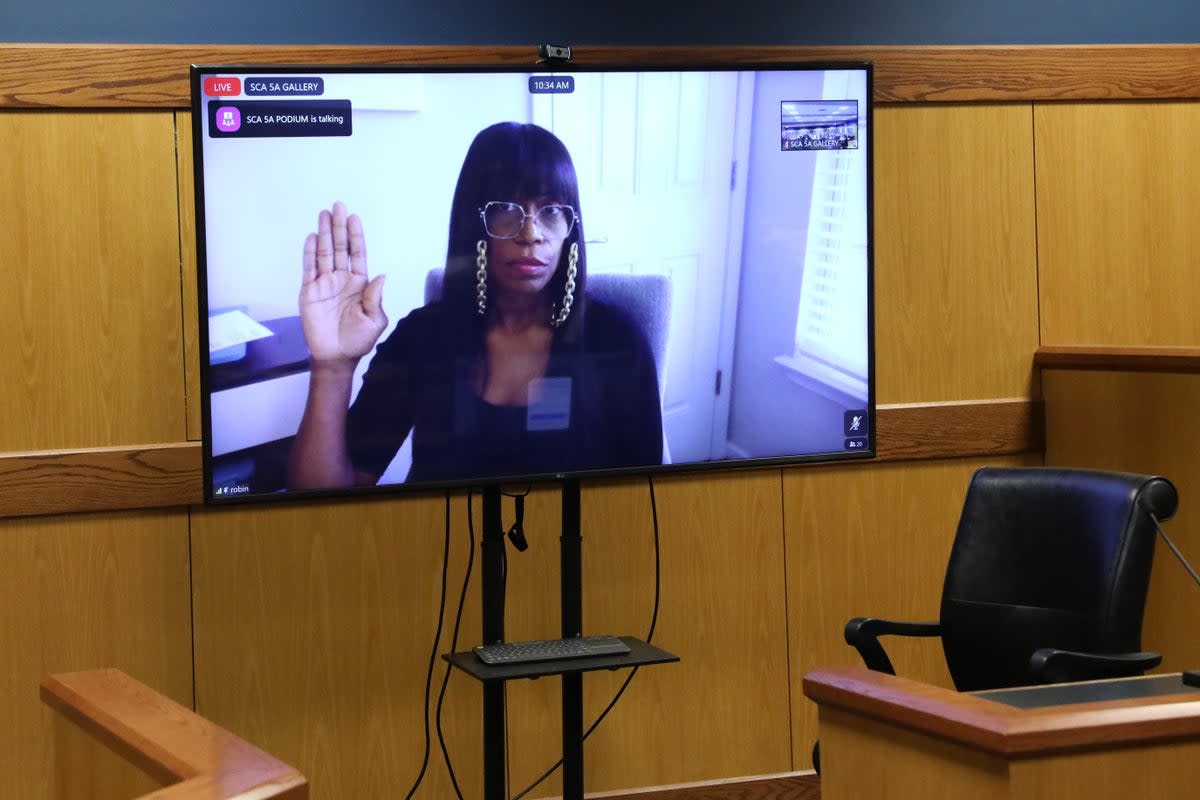 Witness Robin Yeartie appears on a screen as she is sworn in during a hearing in the case of the State of Georgia v Donald Trump (Getty Images)