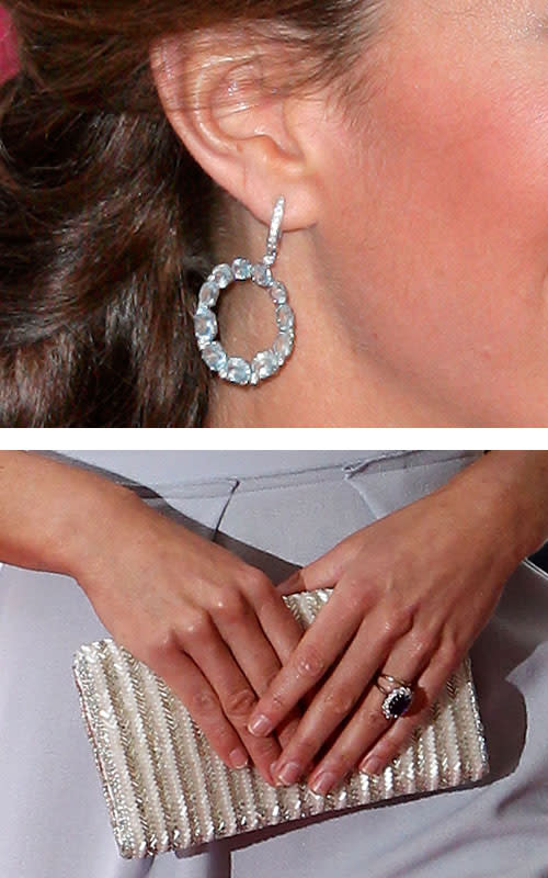 What really set apart Kate's lavender dress were the accessories. At the Olympics she paired her dress with circle diamond earrings and a simple white clutch.