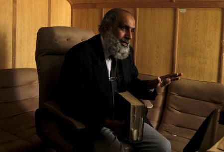 Former military judge Inam ul-Rahiem gestures during an interview with Reuters in Rawalpindi January 24, 2015. REUTERS/Faisal Mahmood