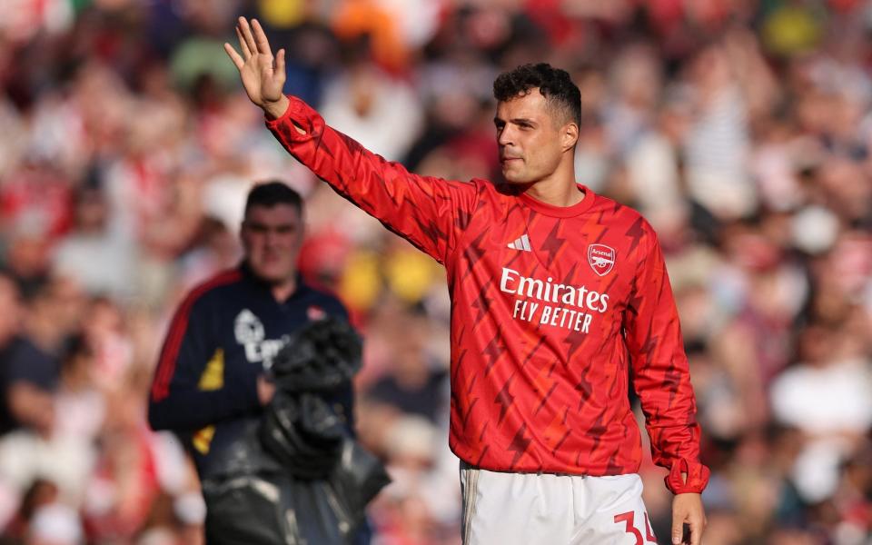 Arsenal's Granit Xhaka waves to fans during the lap of appreciation after the match - Reuters/David Klein