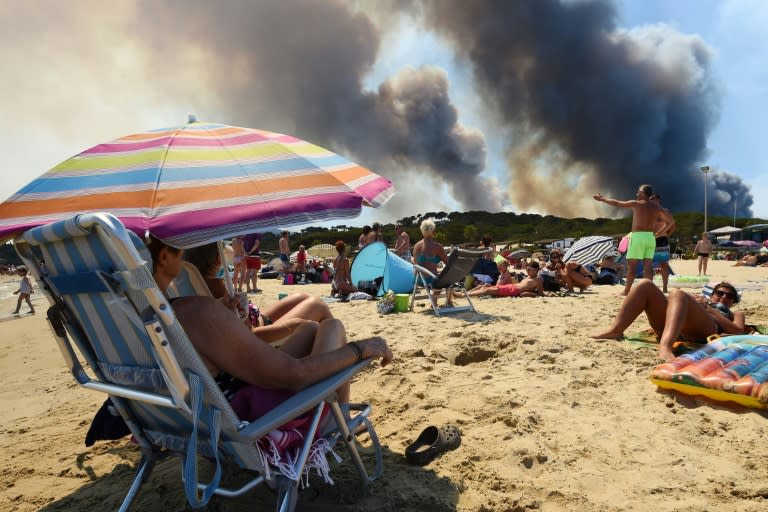 In the French village of Bormes-les-Mimosas, near beaches popular with tourists on the Cote d'Azur, fires that led to the evacuation of 10,000 people overnight Tuesday were largely extinguished