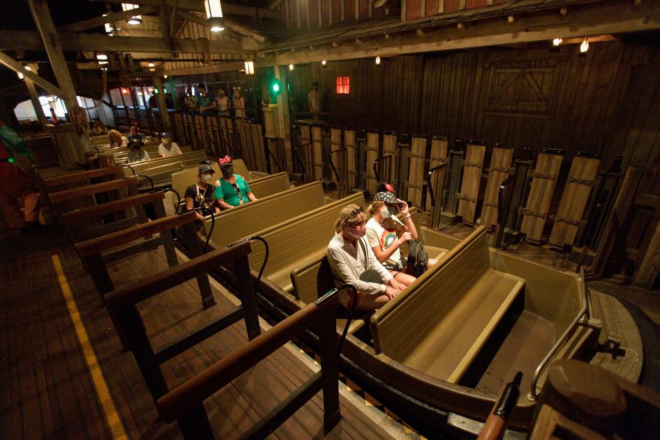 Socially-distanced riders inside Pirates of the Caribbean at Disneyland in Anaheim, CA, on Friday, April 30, 2021. The resort"u2019s parks have been closed for 412 days due to the COVID-19 outbreak.