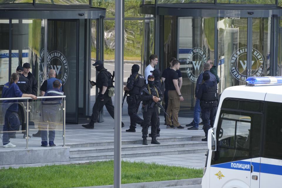 Policemen guard an area near an office of the 'PMC Wagner Centre', which is associated with the owner of the Wagner private military contractor, Yevgeny Prigozhin, in St. Petersburg, Russia, Saturday, June 24, 2023. Russian President Vladimir Putin vowed Saturday to defend Russia against an armed rebellion by Prigozhin, who led his troops out of Ukraine and into a key city south of Moscow. (AP Photo)