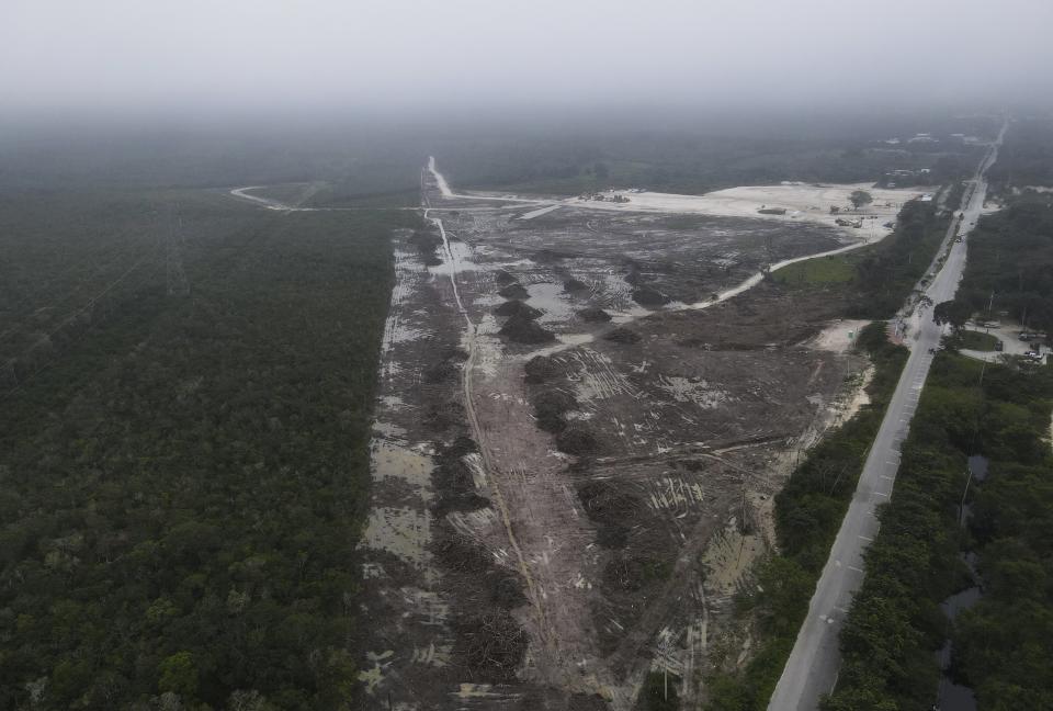 Trees have been cleared for a section of the Maya Train in Xpujil, Mexico, Tuesday, Jan. 10, 2023. The Maya Train is intended to drive economic development to some of the country's poorest areas, in part by bringing up to three million tourists each year. (AP Photo/Marco Ugarte)