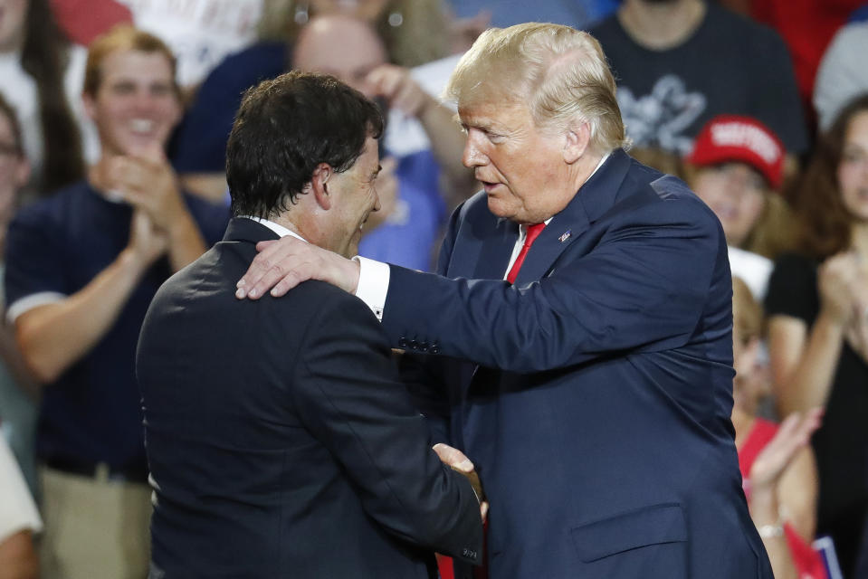President Donald Trump, right, shakes hands with 12th Congressional District Republican candidate Troy Balderson, left, during a rally, Saturday, Aug. 4, 2018, in Lewis Center, Ohio. (AP Photo/John Minchillo)