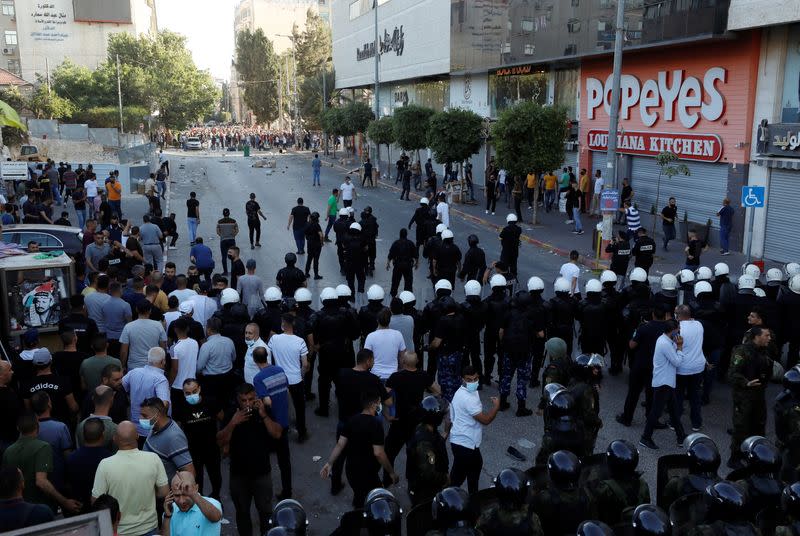 People protest over the death of Nizar Banat, in Ramallah