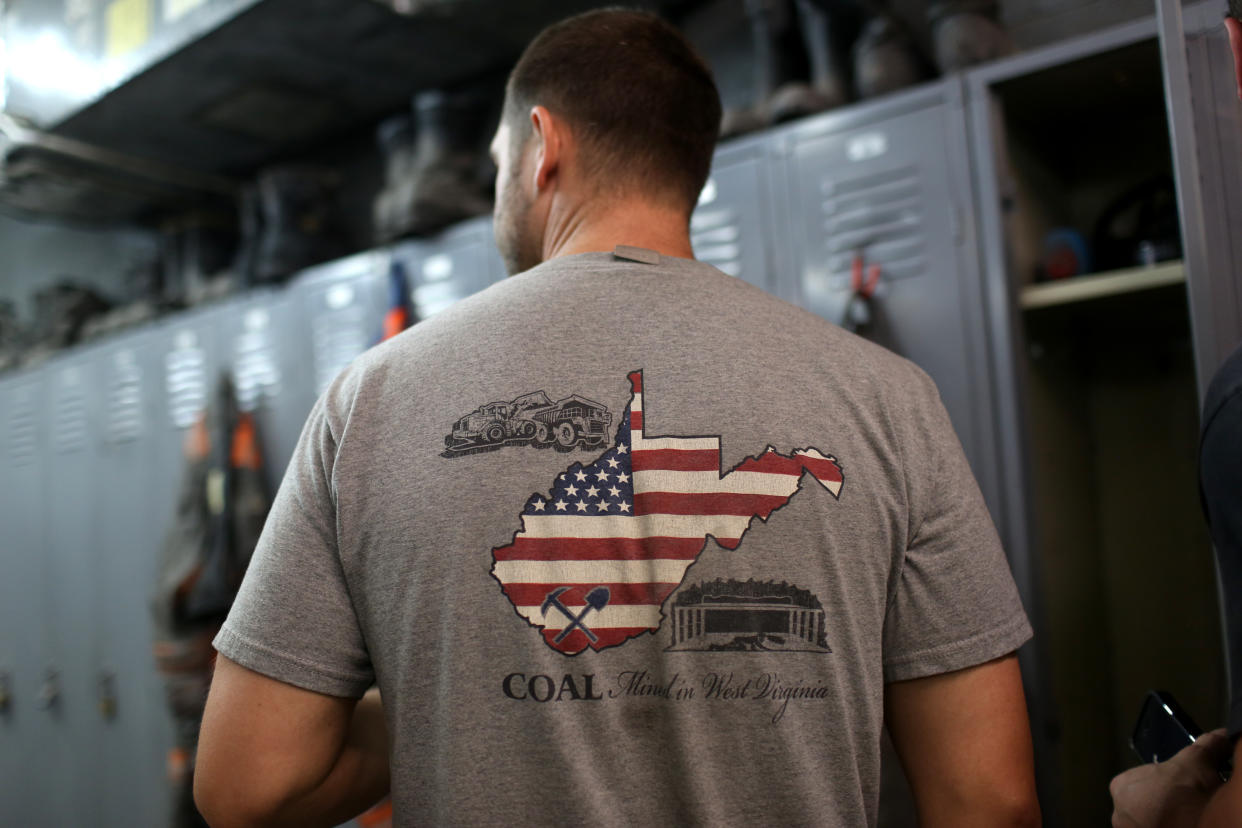 A coal miner wears a T-shirt prior to the start of his afternoon shift at a coal mine near Gilbert, West Virginia May 22, 2014. With coal production slowing due to stricter environmental controls, the availability of natural gas and a shift to surface mining, the state's coal country has been hit hard with job losses and business closures. Picture taken May 22, 2014    REUTERS/Robert Galbraith  (UNITED STATES - Tags: BUSINESS COMMODITIES ENERGY EMPLOYMENT SOCIETY)

ATTENTION EDITORS - PICTURE 01 OF 27 FOR WIDER IMAGE STORY 'DECLINE ALONG THE 'KING COAL HIGHWAY''

SEARCH 'GALBRAITH COAL' FOR ALL IMAGES