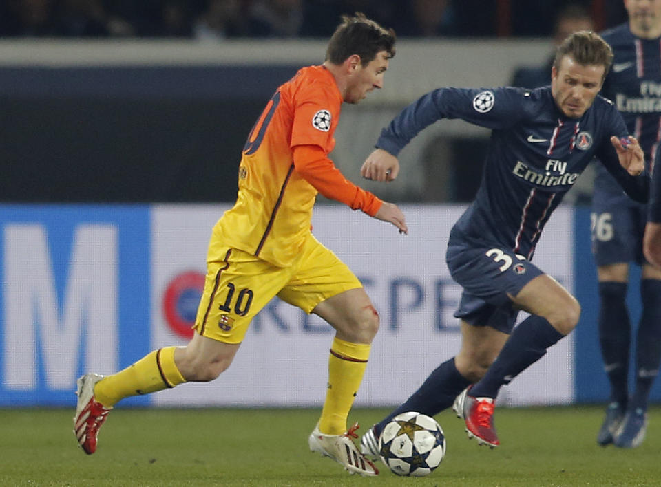 FILE - Barcelona's Lionel Messi, left, vies for the ball with Paris Saint Germain's David Beckham during their UEFA Champions League quarterfinal first leg match between PSG and Barcelona at Parc des Princes stadium, in Paris, Tuesday April 2, 2013. Lionel Messi says he is coming to Inter Miami and joining Major League Soccer. After months of speculation, Messi announced his decision Wednesday, June 7, 2023, to join a Miami franchise that has been led by another global soccer icon in David Beckham since its inception but has yet to make any real splashes on the field. (AP Photo/Francois Mori, File)