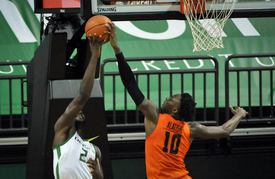 Oregon State forward Warith Alatishe (10) blocks the shot of Oregon forward Eugene Omoruyi (2) during the first half of an NCAA college basketball game Saturday, Jan. 23, 2021, in Eugene, Ore. (AP Photo/Andy Nelson)