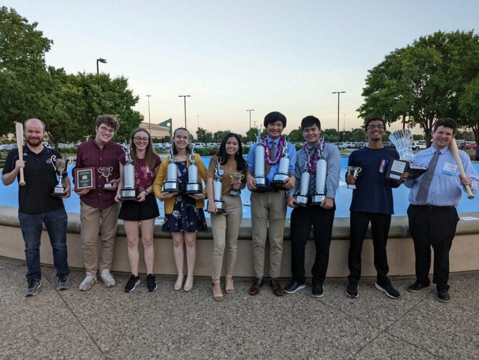 Washburn Rural High School speech and debate students show off the trophies and awards they won at the 2022 National Speech and Debate Association Tournament, held in Louisville, Ky., earlier this month.