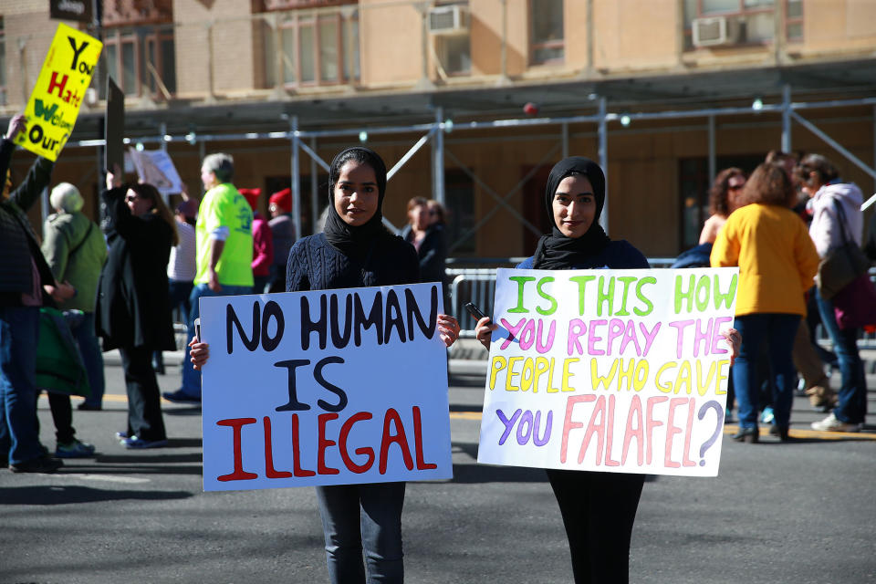 <p>Two Muslim women hold up a signs during the “Not My President’s Day” rally on Central Park West in New York City on Feb. 20, 2017. (Gordon Donovan/Yahoo News) </p>