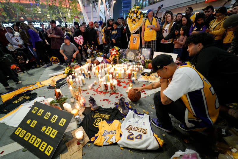 Mourners gather in Microsoft Square near the Staples Center to pay respects to Kobe Bryant after a helicopter crash killed the retired basketball star, in Los Angeles