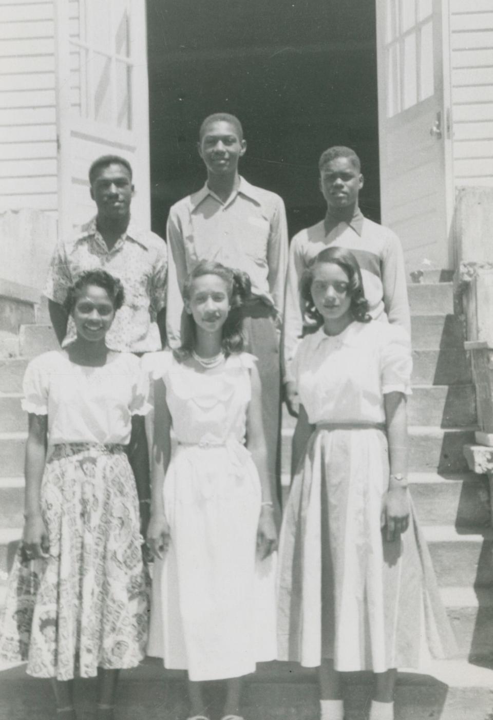 Six honor students stand on the steps of Camden Academy in Wilcox County, Alabama in 1951.