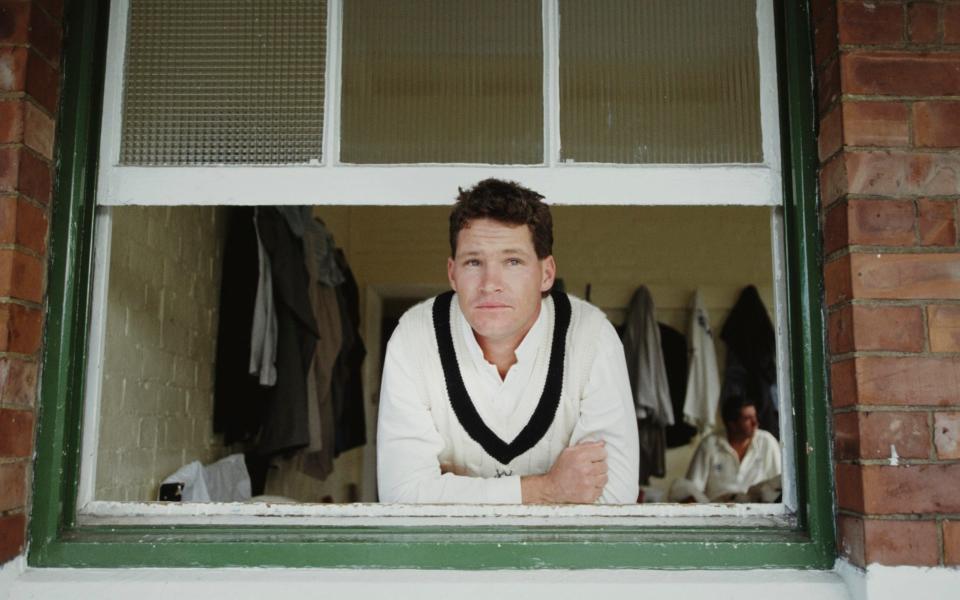 Dean Jones pictured looking out of the Pavillion window at Durham in 1991  - Getty Images