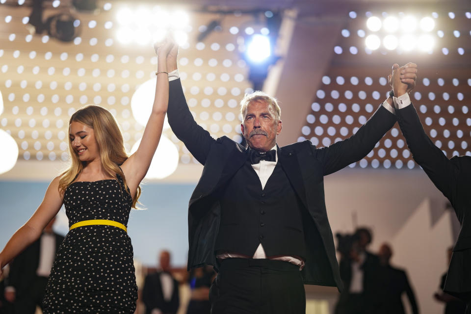 Georgia MacPhail, left, and Kevin Costner pose for photographers upon departure from the premiere of the film 'Horizon: An American Saga' at the 77th international film festival, Cannes, southern France, Sunday, May 19, 2024. (Photo by Scott A Garfitt/Invision/AP)