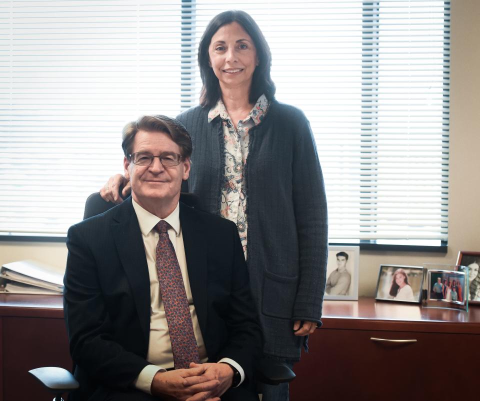 James F. Dover, president and CEO of the Sparrow Health System, with his wife, Maria Dover, at the Sparrow Professional Building Feb. 8, 2023.
