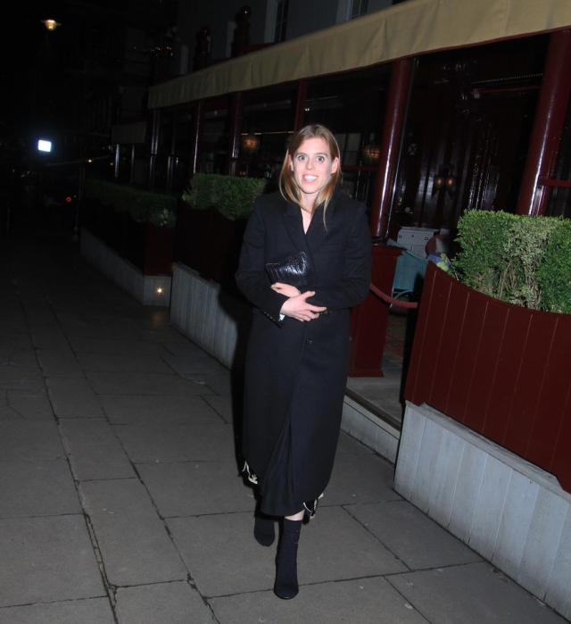 Princess Beatrice smiles as she is spotted leaving a Mayfair restaurant