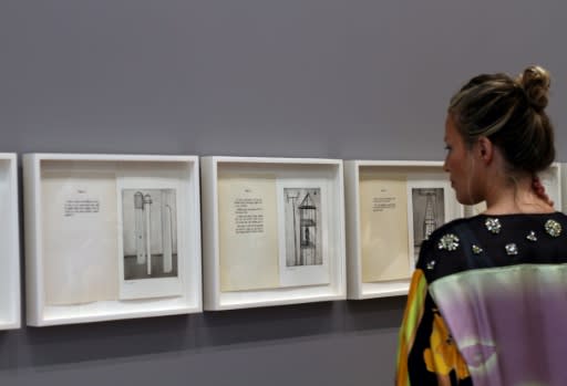 A woman looks at "He Disappeared into Complete Silence" (1947-2005), a limited edition book of 11 engravings by Louise Bourgeois, at Glenstone museum