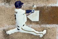Milwaukee Brewers' Jace Peterson hits a single during the seventh inning of a baseball game against the Atlanta Braves Monday, May 16, 2022, in Milwaukee. (AP Photo/Morry Gash)