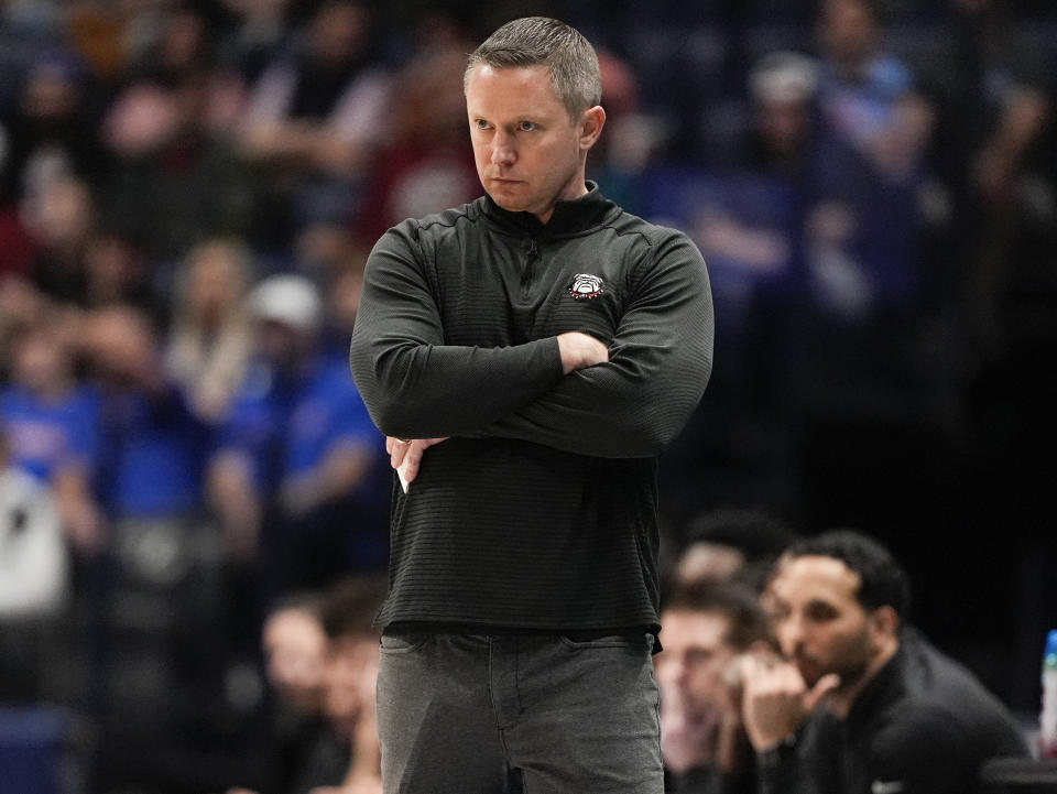 Georgia head coach Mike White watches from the sideline during the first half of an NCAA college basketball game against Florida at the Southeastern Conference tournament Thursday, March 14, 2024, in Nashville, Tenn. (AP Photo/John Bazemore)