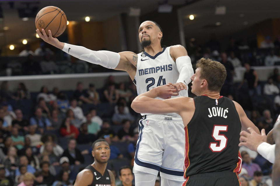 Memphis Grizzlies forward Dillon Brooks (24) shoots against Miami Heat forward Nikola Jovic (5) in the second half of a preseason NBA basketball game Friday, Oct. 7, 2022, in Memphis, Tenn. (AP Photo/Brandon Dill)