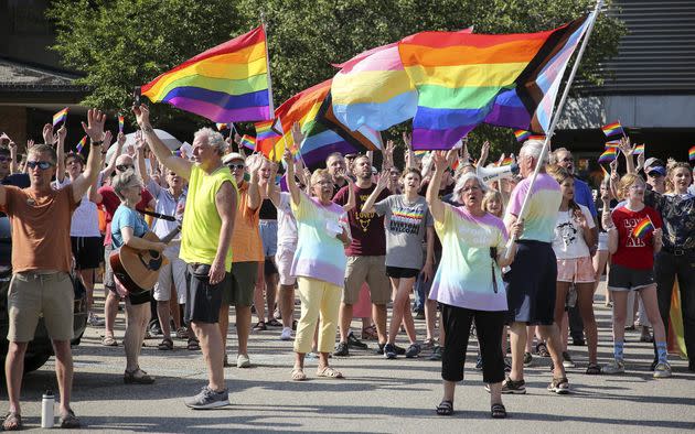 Activists for more acceptance of the LGBTQ community sing and wave flags during the Christian Reformed Church's Synod 2022, which took place on the Calvin University campus. (Photo: Steven Herppich / Christian Reformed Church in NA / crcna.org)