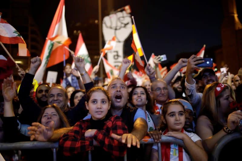 Protesters react at a demonstration during ongoing anti-government protests in Beirut