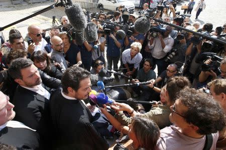 Former trader Jerome Kerviel (L) and his lawyer David Koubbi (R) answer reporters outside the courthouse in Versailles, France, September 23, 2016. REUTERS/Charles Platiau