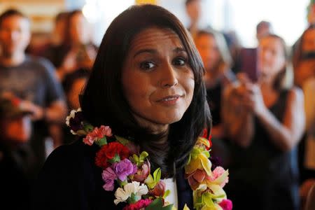 FILE PHOTO: Democratic 2020 U.S. presidential candidate and U.S. Representative Tulsi Gabbard (D-HI) speaks during a campaign stop at the Green Elephant in Portsmouth, New Hampshire, U.S., February 17, 2019. REUTERS/Brian Snyder/Files