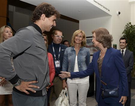 Queen Sofia of Spain greets compatriot Rafael Nadal and his mother Ana (C) after he defeated Novak Djokovic of Serbia in the men's singles final match at the U.S. Open tennis championships in New York, September 9, 2013. REUTERS/Andrew Gombert/pool