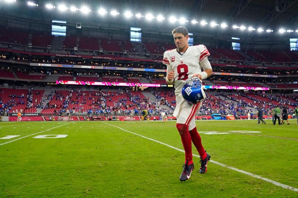 New York Giants quarterback Daniel Jones (8) runs off the field after defeating the Arizona Cardinals in an NFL football game, Sunday, Sept. 17, 2023, in Glendale, Ariz. (AP Photo/Matt York)