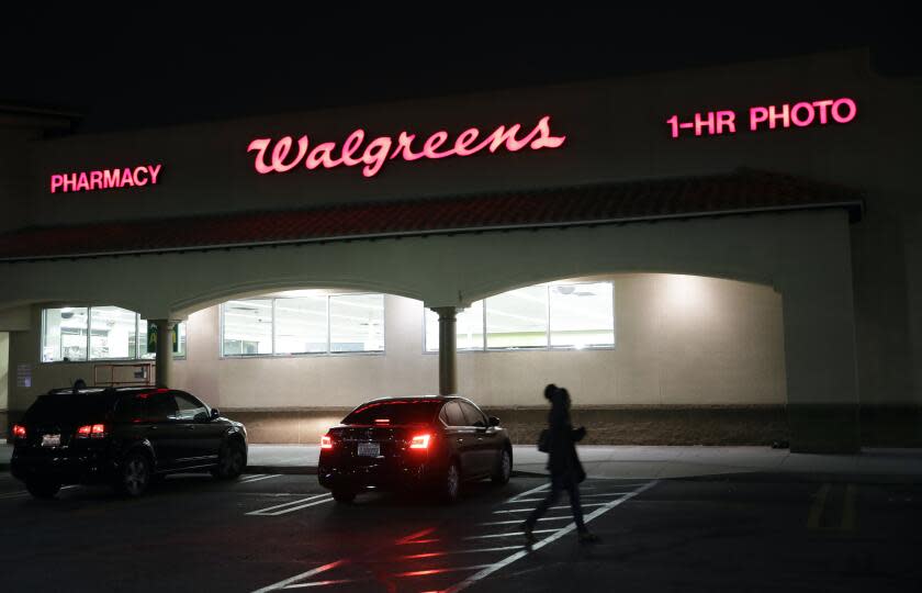 FILE - This June 24, 2019 file photo shows an exterior view of a Walgreens store in Los Angeles. Walgreens will pay $7.5 million to settle with California authorities after an employee was criminally charged with impersonating a pharmacist and illegally filling more than 745,000 prescriptions in the San Francisco Bay Area. Kim Thien Le has pleaded not guilty to felony impersonation charges. (AP Photo/Marcio Jose Sanchez,File)