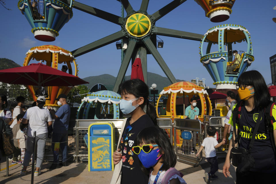 People visit the newly-reopened Ocean Park, marine mammal and amusement park, Thursday, April 21, 2022. Hong Kong Ocean Park reopened to the public after shutting down due to a surge in COVID-19 infections. (AP Photo/Kin Cheung)