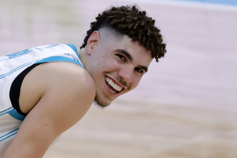 CHARLOTTE, NORTH CAROLINA - FEBRUARY 03: LaMelo Ball #2 of the Charlotte Hornets looks on during the fourth quarter of their game against the Philadelphia 76ers at Spectrum Center on February 03, 2021 in Charlotte, North Carolina. NOTE TO USER: User expressly acknowledges and agrees that, by downloading and or using this photograph, User is consenting to the terms and conditions of the Getty Images License Agreement. (Photo by Jared C. Tilton/Getty Images)