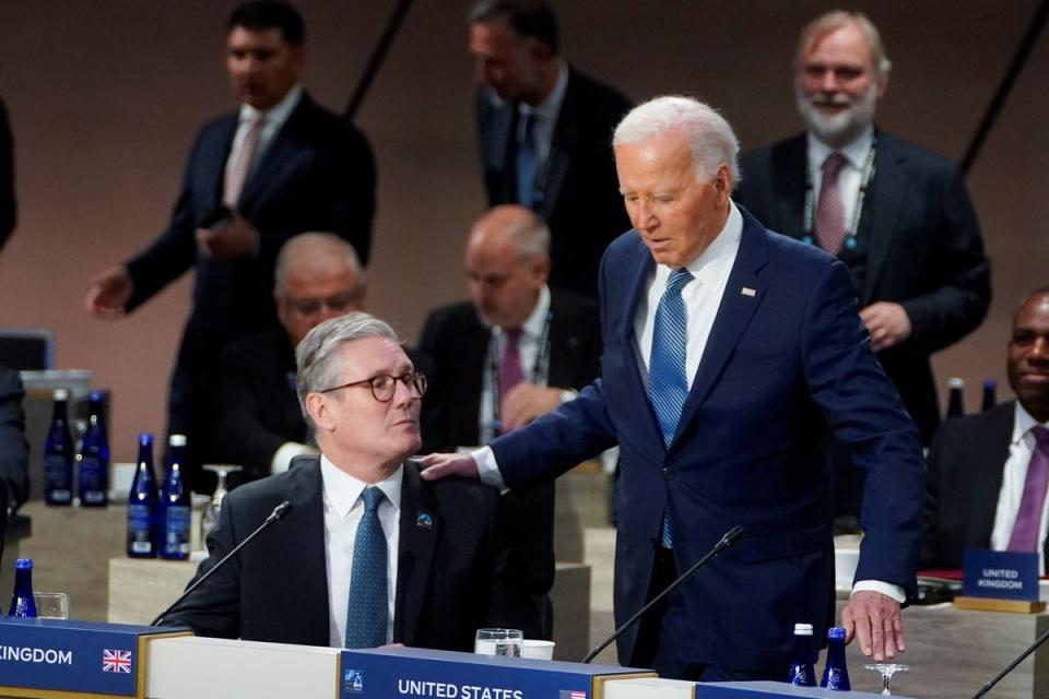 Britain's Prime Minister Keir Starmer and Joe Biden attend a Nato meeting (REUTERS)