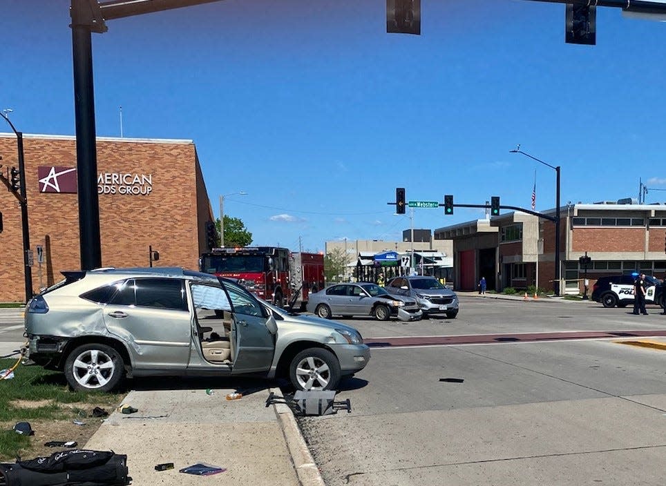 A wrecked Lexus straddles a sidewalk after it and two other cars collided May 15 at University Avenue and North Webster Avenue in Green Bay.