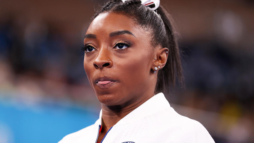 American gymnastic champion Simone Biles has pulled out of the team gymnastics competition at the Tokyo Olympics. (Photo by Laurence Griffiths/Getty Images)