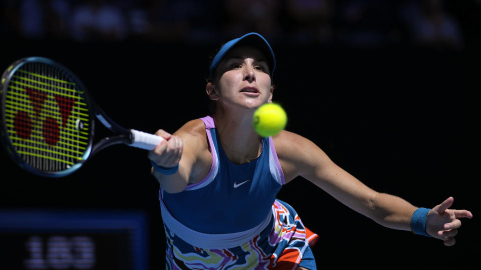 Belinda Bencic of Switzerland plays a forehand return to Aryna Sabalenka of Belarus during their fourth round match at the Australian Open tennis championship in Melbourne, Australia, Monday, Jan. 23, 2023. (AP Photo/Aaron Favila)