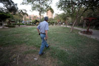 An Iraqi refugee and former interpreter for the U.S. Army in Iraq walks with his military hat in a garden on the outskirts of Cairo, Egypt August 8, 2018. REUTERS/Staff