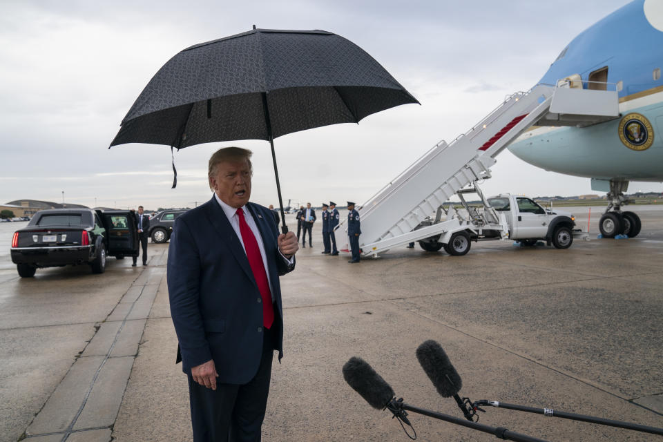 President Donald Trump speaks to reporters at Andrews Air Force Base, Md., as as he returns from campaign stops in Florida and Georgia Friday, Sept. 25, 2020. (AP Photo/Evan Vucci)