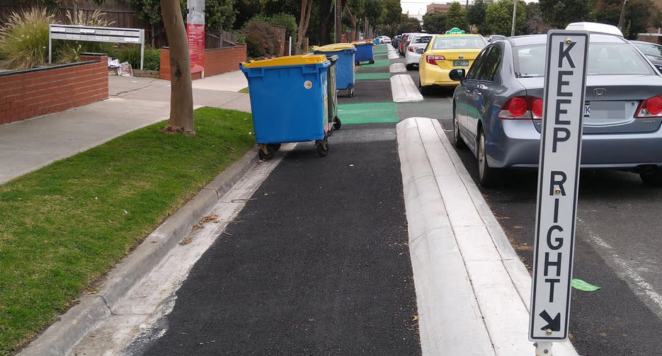 Eldridge Street in Footscray is pictured with large bins sitting in the bike lane.