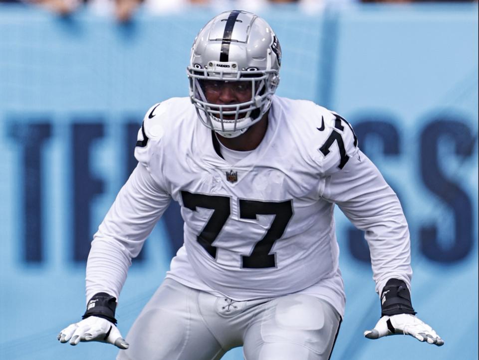 Las Vegas Raiders offensive tackle Thayer Munford Jr. (77) blocks during their game against the <a class="link " href="https://sports.yahoo.com/nfl/teams/tennessee/" data-i13n="sec:content-canvas;subsec:anchor_text;elm:context_link" data-ylk="slk:Tennessee Titans;sec:content-canvas;subsec:anchor_text;elm:context_link;itc:0">Tennessee Titans</a> Sunday, Sept. 25, 2022, in Nashville, Tenn. (AP Photo/Wade Payne)