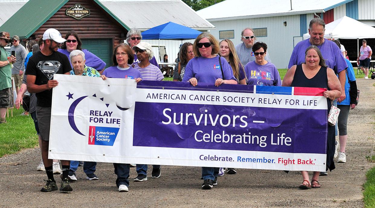 Cancer survivors complete the first lap of Relay for Life following the Relay for Life opening ceremony  Saturday, June 4, 2022 at the Ashland County Fairgrounds. LIZ A. HOSFELD/FOR TIMES-GAZETTE.COM