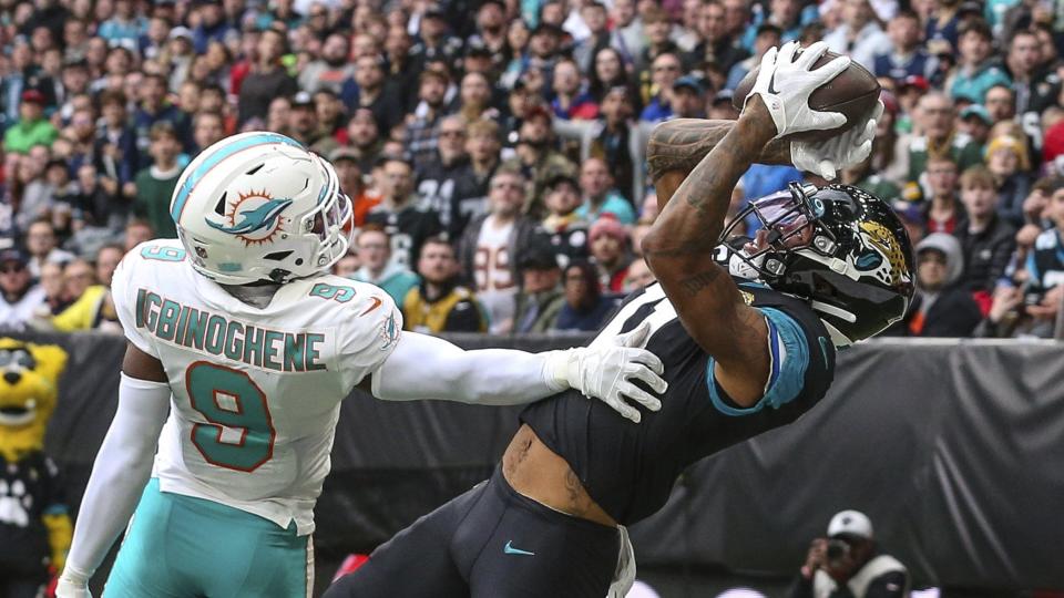 Dolphins cornerback Noah Igbinoghene tries to defend against Jaguars receiver Marvin Jones.